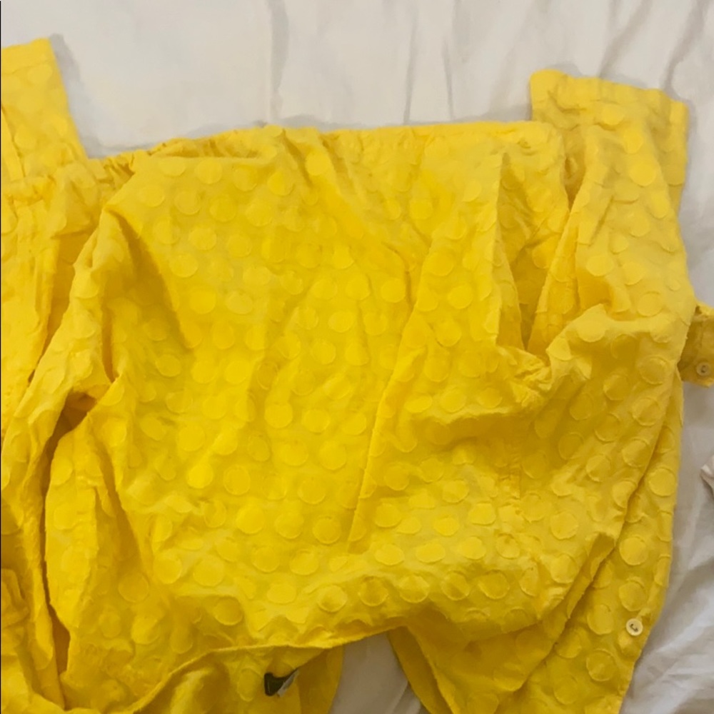 A adjustable length yellow crop top with string